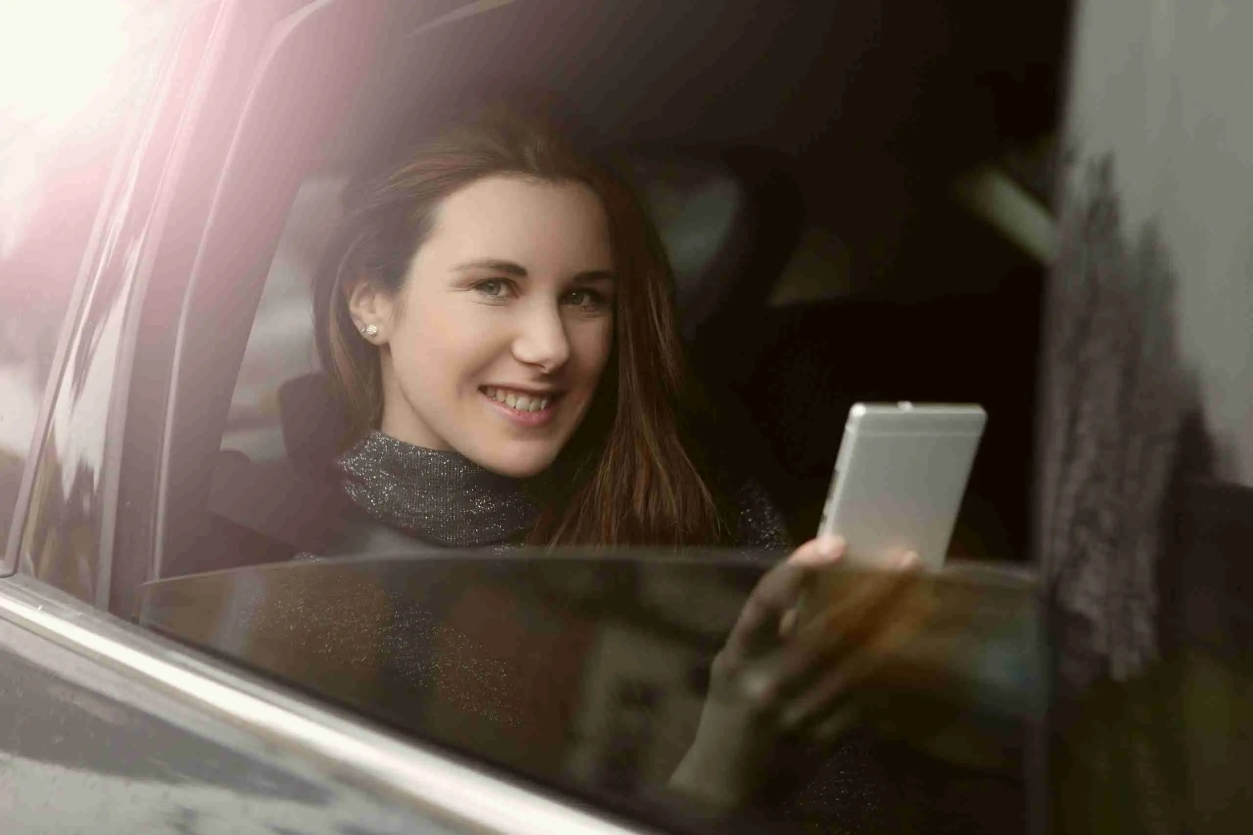 Passenger relaxing in the back of the car