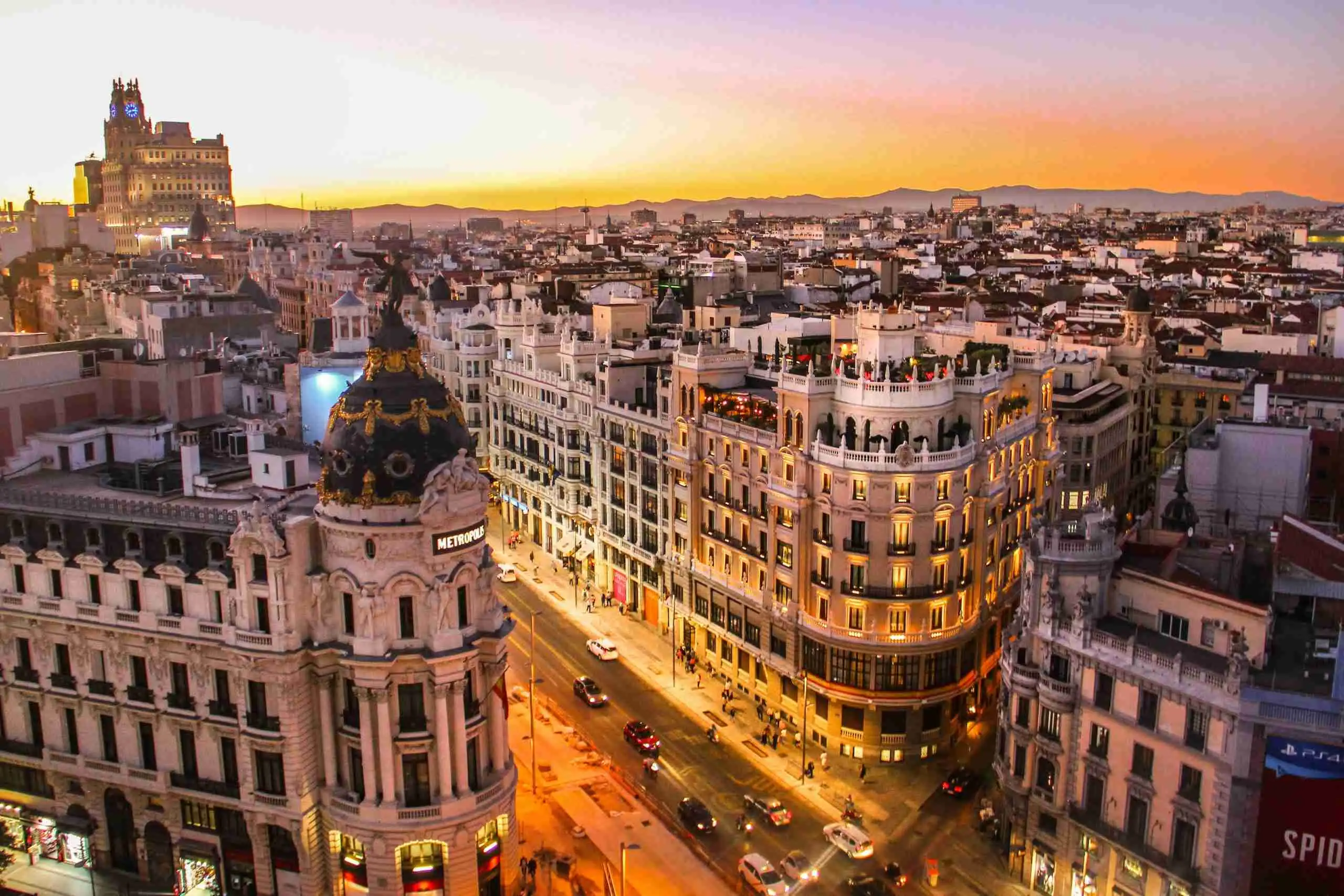 Gran Vía and the Metropolis building in Madrid at sunset